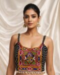 Navratri Kutchi spaghetti strap blouse in rayon cotton with mirror work, patchwork and kodi, sleeveless square neck black