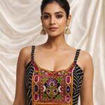 Navratri Kutchi spaghetti strap blouse in rayon cotton with mirror work, patchwork and kodi, sleeveless square neck black