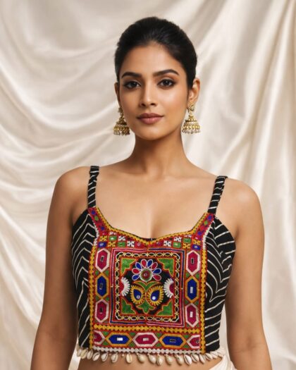 Navratri Kutchi spaghetti strap blouse in rayon cotton with mirror work, patchwork and kodi, sleeveless square neck black