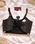 Navratri Kutchi spaghetti strap blouse in rayon cotton with mirror work, patchwork and kodi, sleeveless square neck black