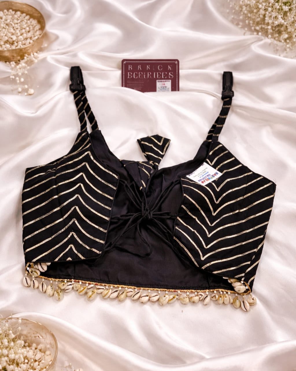 Navratri Kutchi spaghetti strap blouse in rayon cotton with mirror work, patchwork and kodi, sleeveless square neck black