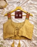 Navratri garba halter neck blouse in magic cotton with embroidery and mirror work, sleeveless off white