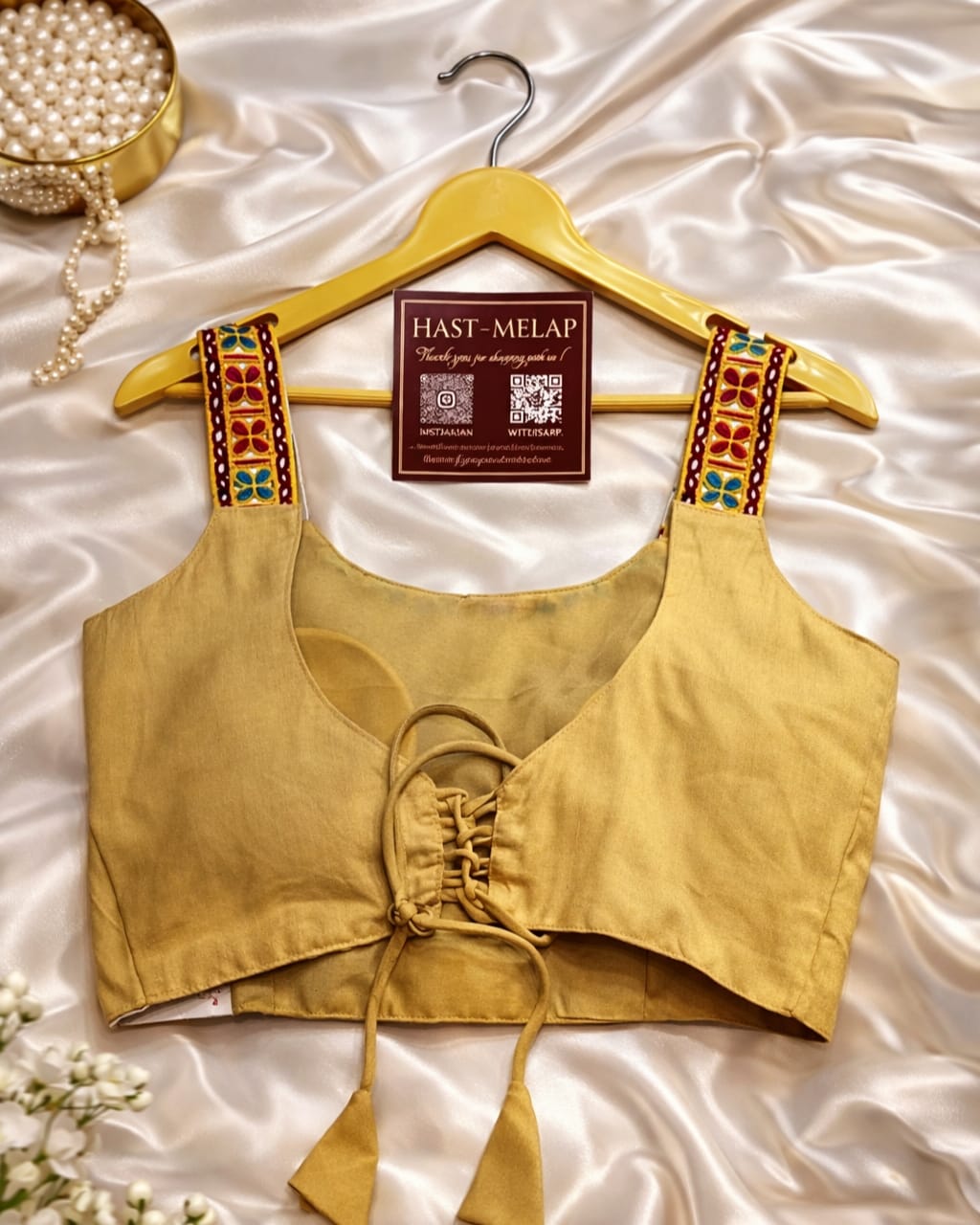 Navratri garba halter neck blouse in magic cotton with embroidery and mirror work, sleeveless off white